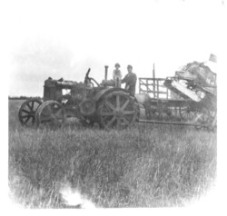 Case Tractor. Threshing machine. Belonged to community. Nick J. Chernoff and daughter Helen operators. Case Tractor. Threshing machine.
